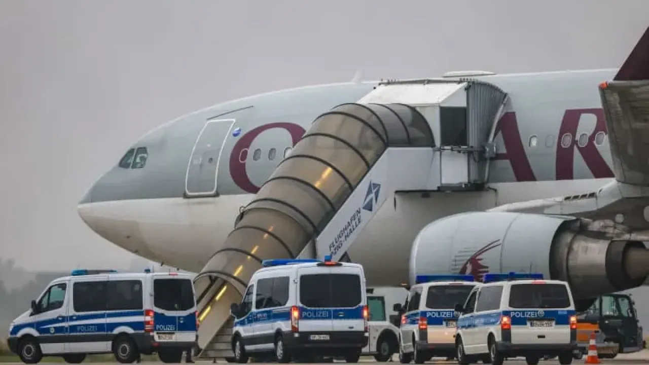 Police vehicles stand in front of a Qatar Airways plane at Leipzig/Halle Airport. Representatives from Germany&#39;s Interior Ministry have held discussions in Kabul on conducting regular deportation flights of Afghan criminal offenders, a ministry spokeswoman confirmed on Sunday. Jan Woitas/dpa