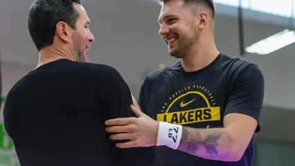 El Segunda, CA, Monday, September 29, 2025 - Lakers forward Luka Doncic greets head coach JJ Redick during media day at UCLA Health Training Center. (Robert Gauthier/Los Angeles Times)