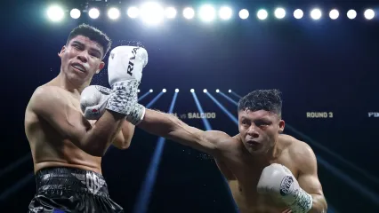 LAS VEGAS, NEVADA - JULY 19: Isaac Cruz (R) punches Omar Salcido to a unanimous decision win during their WBC interim super lightweight title fight at MGM Grand Garden Arena on July 19, 2025 in Las Vegas, Nevada.  (Photo by Harry How/Getty Images)