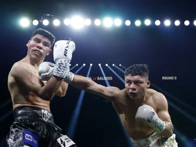 LAS VEGAS, NEVADA - JULY 19: Isaac Cruz (R) punches Omar Salcido to a unanimous decision win during their WBC interim super lightweight title fight at MGM Grand Garden Arena on July 19, 2025 in Las Vegas, Nevada.  (Photo by Harry How/Getty Images)