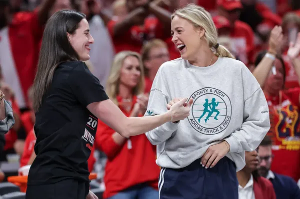 INDIANAPOLIS, INDIANA - SEPTEMBER 16: Caitlin Clark (L) and Sophie Cunningham of the Indiana Fever react during the second half against the Atlanta Dream in game two of the first round of WNBA Playoffs at Gainbridge Fieldhouse on September 16, 2025 in Indianapolis.