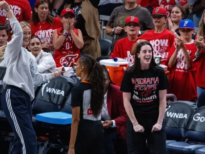 Sep 16, 2025; Indianapolis, Indiana, USA; Indiana Fever guard Caitlin Clark (22) and guard Sophie Cunningham (8) on the sideline during game two of round one against the Atlanta Dream for the 2025 WNBA Playoffs at Gainbridge Fieldhouse.