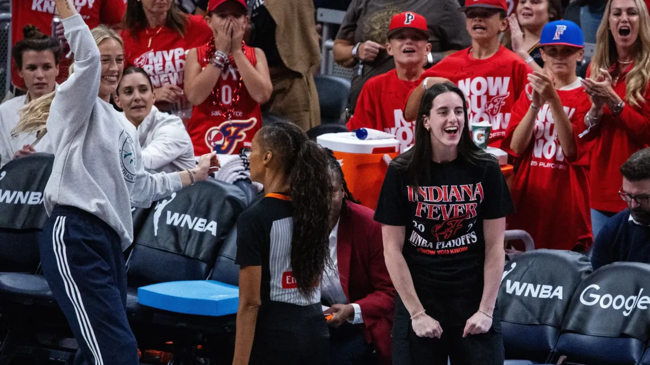 Sep 16, 2025; Indianapolis, Indiana, USA; Indiana Fever guard Caitlin Clark (22) and guard Sophie Cunningham (8) on the sideline during game two of round one against the Atlanta Dream for the 2025 WNBA Playoffs at Gainbridge Fieldhouse.