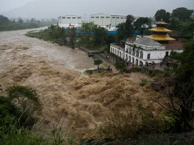 Water level rises in the Bagmati river during the rainfall in Kathmandu, Nepal on October 4, 2025. The National Disaster Risk Reduction and Management Authority has announced, vehicle movement in and out of the Kathmandu valley has been suspended for three days from October 4 to 6 due to the forecast of floods and landslides from the Department of Hydrology and Meteorology.