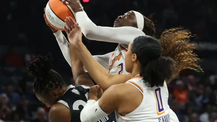 Kahleah Copper #2 of the Phoenix Mercury grabs a rebound over Jewell Loyd #24 of the Las Vegas Aces and Satou Sabally #0 in the first quarter of Game One of the 2025 WNBA Playoffs finals at Michelob ULTRA Arena on October 03, 2025, in Las Vegas.