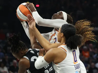 Kahleah Copper #2 of the Phoenix Mercury grabs a rebound over Jewell Loyd #24 of the Las Vegas Aces and Satou Sabally #0 in the first quarter of Game One of the 2025 WNBA Playoffs finals at Michelob ULTRA Arena on October 03, 2025, in Las Vegas.