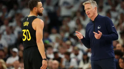 MINNEAPOLIS, MINNESOTA - MAY 06: Head coach Steve Kerr talks to Stephen Curry #30 of the Golden State Warriors in the second quarter of Game One against the Minnesota Timberwolves during the Second Round of the 2025 NBA Playoffs at Target Center on May 06, 2025 in Minneapolis, Minnesota. The Warriors defeated the Timberwolves 99-88 to take a 1-0 series lead. NOTE TO USER: User expressly acknowledges and agrees that, by downloading and or using this photograph, User is consenting to the terms and conditions of the Getty Images License Agreement. (Photo by David Berding/Getty Images)