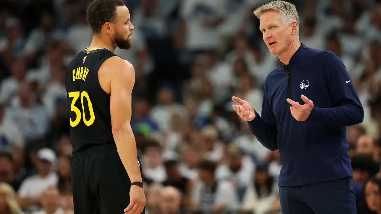 MINNEAPOLIS, MINNESOTA - MAY 06: Head coach Steve Kerr talks to Stephen Curry #30 of the Golden State Warriors in the second quarter of Game One against the Minnesota Timberwolves during the Second Round of the 2025 NBA Playoffs at Target Center on May 06, 2025 in Minneapolis, Minnesota. The Warriors defeated the Timberwolves 99-88 to take a 1-0 series lead. NOTE TO USER: User expressly acknowledges and agrees that, by downloading and or using this photograph, User is consenting to the terms and conditions of the Getty Images License Agreement. (Photo by David Berding/Getty Images)