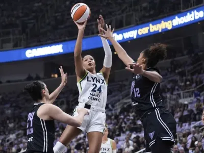Minnesota Lynx forward Napheesa Collier shoots over Golden State Valkyries defenders in the WNBA basketball playoffs Wednesday, Sept. 17, 2025. - Godofredo A. V&#xe1;squez/AP
