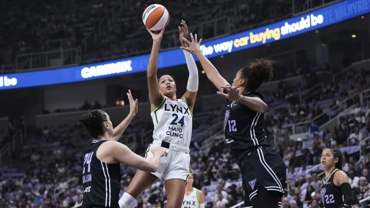 Minnesota Lynx forward Napheesa Collier shoots over Golden State Valkyries defenders in the WNBA basketball playoffs Wednesday, Sept. 17, 2025. - Godofredo A. V&#xe1;squez/AP