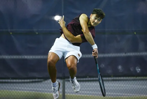 Bloomington North’s Brady Murphy serves the ball during his No. 1 singles match against Bloomington South’s Caleb Lian during the IHSAA boys’ tennis sectional first round at South on Tuesday, Sept. 30, 2025.