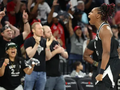 <span>Chelsea Gray of the Las Vegas Aces celebrates after defeating the Phoenix Mercury in Game 1 of the WNBA finals on Friday night.</span><span>Photograph: Ian Maule/Getty Images</span>
