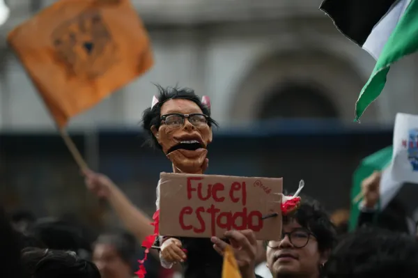 A protester holds a doll representing former President Gustavo Diaz Ordaz during a protest commemorating the anniversary of the 1968 Tlatelolco killings, when soldiers fired on student protesters, in Mexico City, Thursday, Oct. 2, 2025. (AP Photo/Eduardo Verdugo)(ASSOCIATED PRESS)