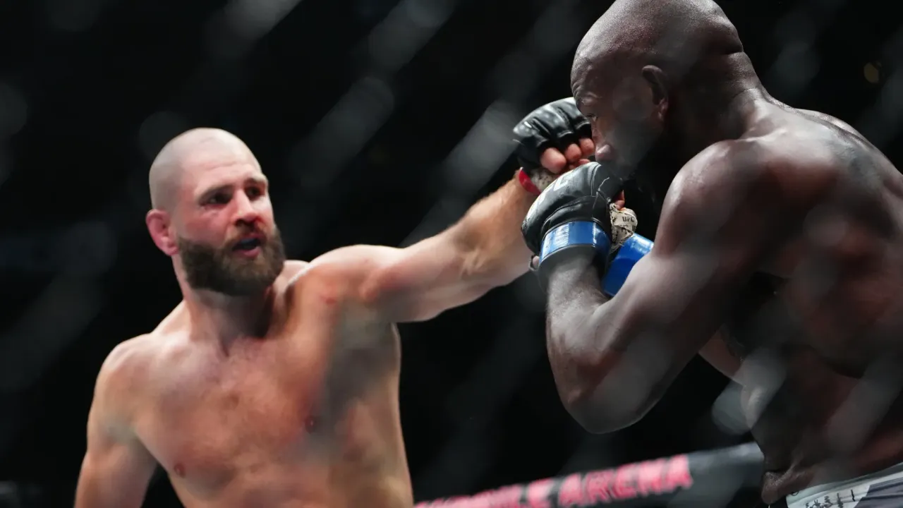 Oct 4, 2025; Las Vegas, Nevada, UNITED STATES; Jiri Prochazka (red gloves) fights Khalil Rountree Jr (blue gloves) during UFC 320 at T-Mobile Arena. Mandatory Credit: Stephen R. Sylvanie-Imagn Images