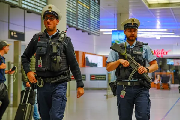 Police officers patrol Munich Airport after the airport shut down operations due to possible new drone sightings Friday, Oct. 3, 2025, in Munich. (Enrique Kaczor/dpa via AP)(ASSOCIATED PRESS)