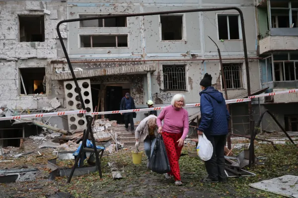 Residents take their belongings from their house destroyed by a Russian strike in Zaporizhzhia, Ukraine, Sunday, Oct. 5, 2025. (AP Photo/Kateryna Klochko)(ASSOCIATED PRESS)