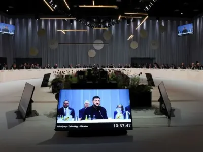 A screen displays Ukrainian President Volodymyr Zelensky speaking during the 7th European Political Community (EPC) Summit at the Bella Center in Copenhagen Suzanne Plunkett/PA Wire/dpa