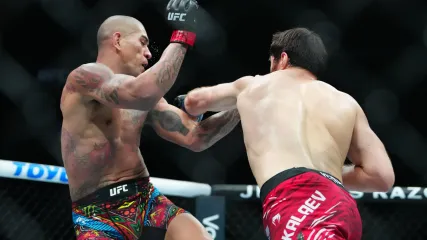 Mar 8, 2025; Las Vegas, Nevada, USA; Alex Pereira (red gloves) fights Magomed Ankalaev (blue gloves) during UFC 313 at T-Mobile Arena. Mandatory Credit: Stephen R. Sylvanie-Imagn Images