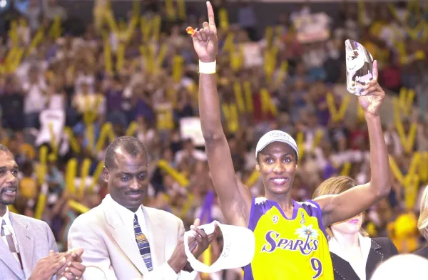 1 Sep 2001: Lisa Leslie #9 of the Los Angeles Sparks holds the 2001 Finals MVP trophy after defeating the Charlotte Sting in game two of the WNBA Finals at Staples Center in Los Angeles, California. The Sparks won 82-54 to sweep the series 2-0 and take the Championship. DIGITAL IMAGE Mandatory Credit: Harry How/Allsport