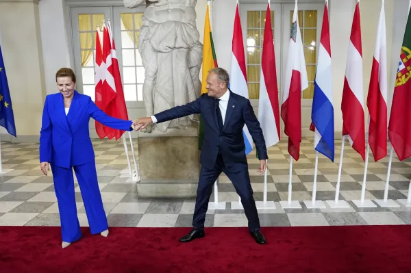 Denmark's Prime Minister Mette Frederiksen, left, shares a light moment with Poland's Prime Minister Donald Tusk as she welcomes him for an informal summit in the Danish parliament at Christiansborg Castle in Copenhagen, Wednesday, Oct. 1, 2025. (Liselotte Sabroe/Ritzau Scanpix via AP)(ASSOCIATED PRESS)