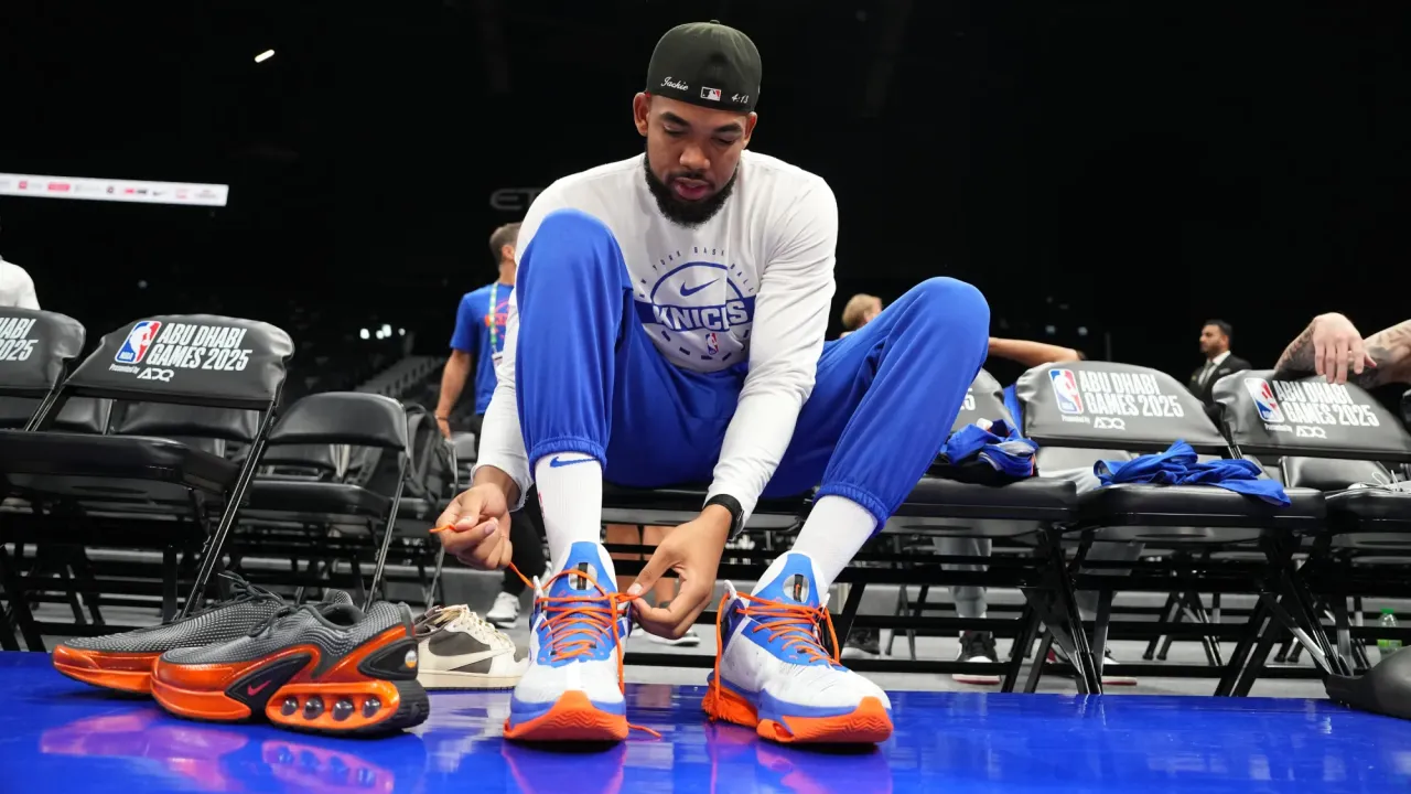ABU DHABI, UAE - OCTOBER 1: Karl-Anthony Towns #32 of the New York Knicks laces up during practice and media availability as part of 2025 NBA Global Games Abu Dhabi at Etihad Arena on October 1, 2025 in Abu Dhabi, The United Arab Emirates. NOTE TO USER: User expressly acknowledges and agrees that, by downloading and/or using this Photograph, user is consenting to the terms and conditions of the Getty Images License Agreement. Mandatory Copyright Notice: Copyright 2025 NBAE (Photo by Jesse D. Garrabrant/NBAE via Getty Images)