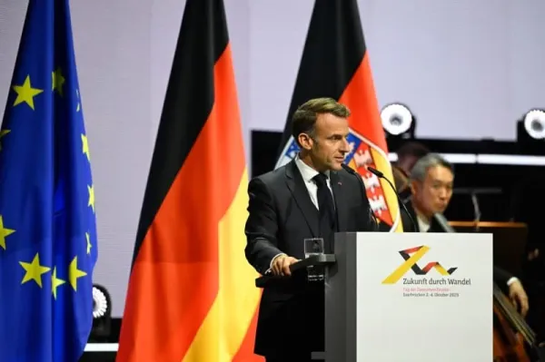 French President Emmanuel Macron speaks at the central celebrations for the Day of German Unity in the Congress Hall. On October 3, 2025, Germany celebrates the 35th anniversary of German reunification. Jean-Christophe Verhaegen/POOL AFP/dpa