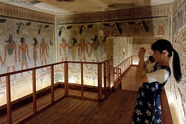 A tourist visits the tomb of King Amenhotep III in the Valley of the Kings after it was officially opened to the public after nearly two decades of restoration and maintenance work. / Credit: -/AFP via Getty Images