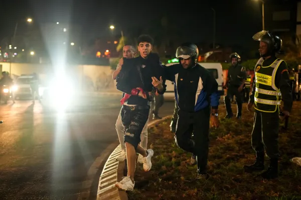 A boy is detained as youth led protests calling for healthcare and education reforms turned violent, in Sale, Morocco, Wednesday, Oct. 1, 2025. (AP Photo/Mosa'ab Elshamy)(ASSOCIATED PRESS)