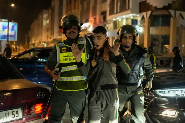 A boy is detained as youth led protests calling for healthcare and education reforms turned violent, in Sale, Morocco, Wednesday, Oct. 1, 2025. (AP Photo/Mosa'ab Elshamy)(ASSOCIATED PRESS)