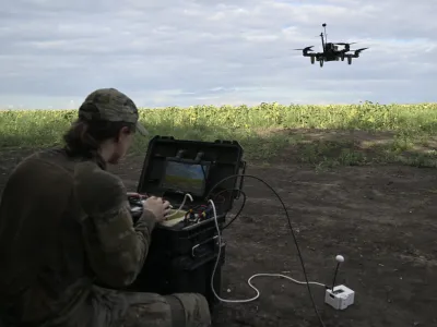 A drone pilot operates an FPV drone during a training flight in August 2025.