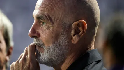 A pensive Stefano Pioli gazes into the distance.