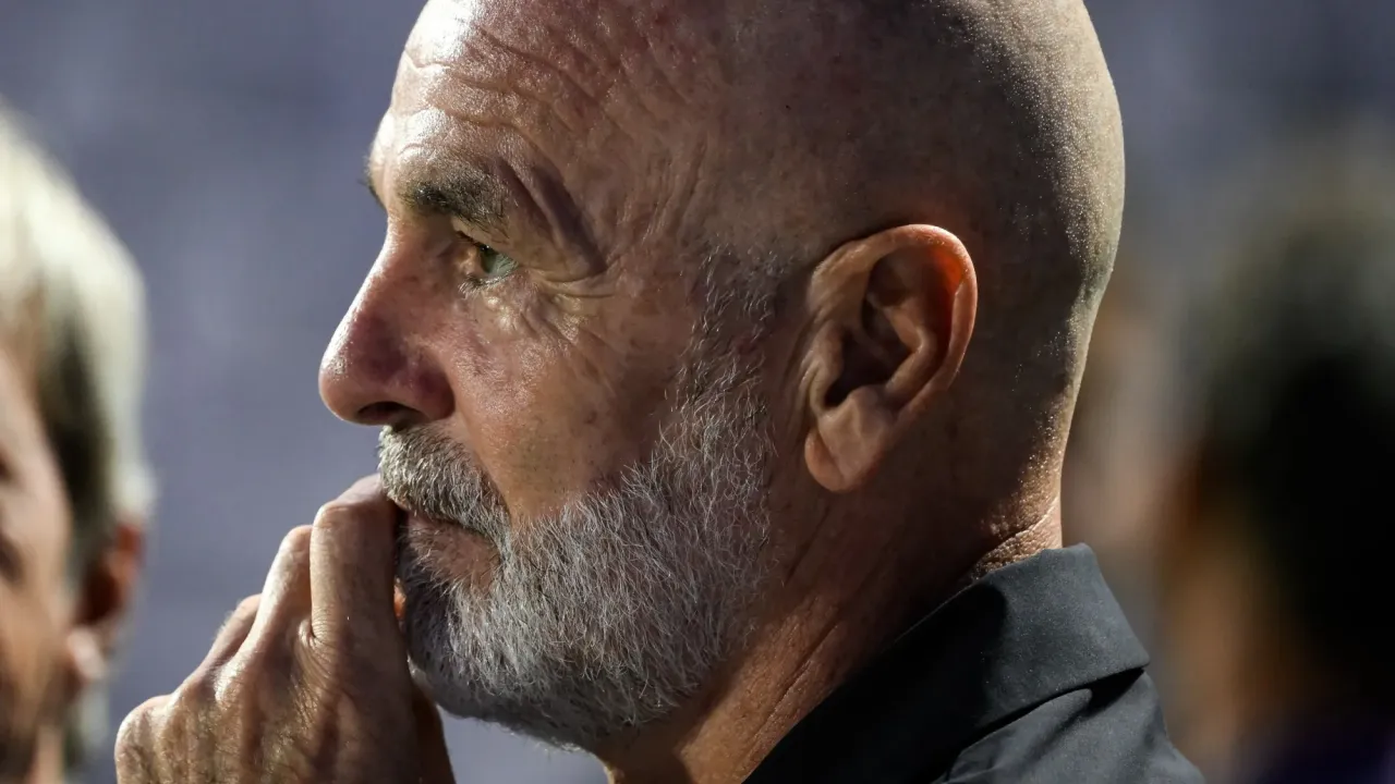 A pensive Stefano Pioli gazes into the distance.