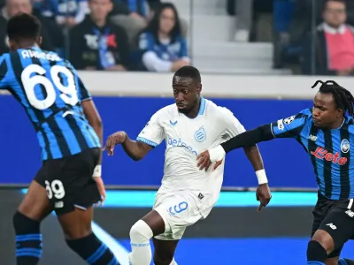 Ademola Lookman challenges for the ball against Club Brugges