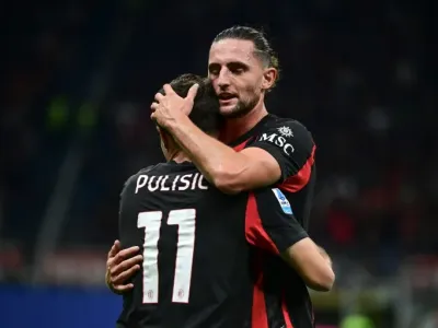 Adrien Rabiot celebrates Christian Pulisic's goal for AC Milan against Napoli (Piero CRUCIATTI)