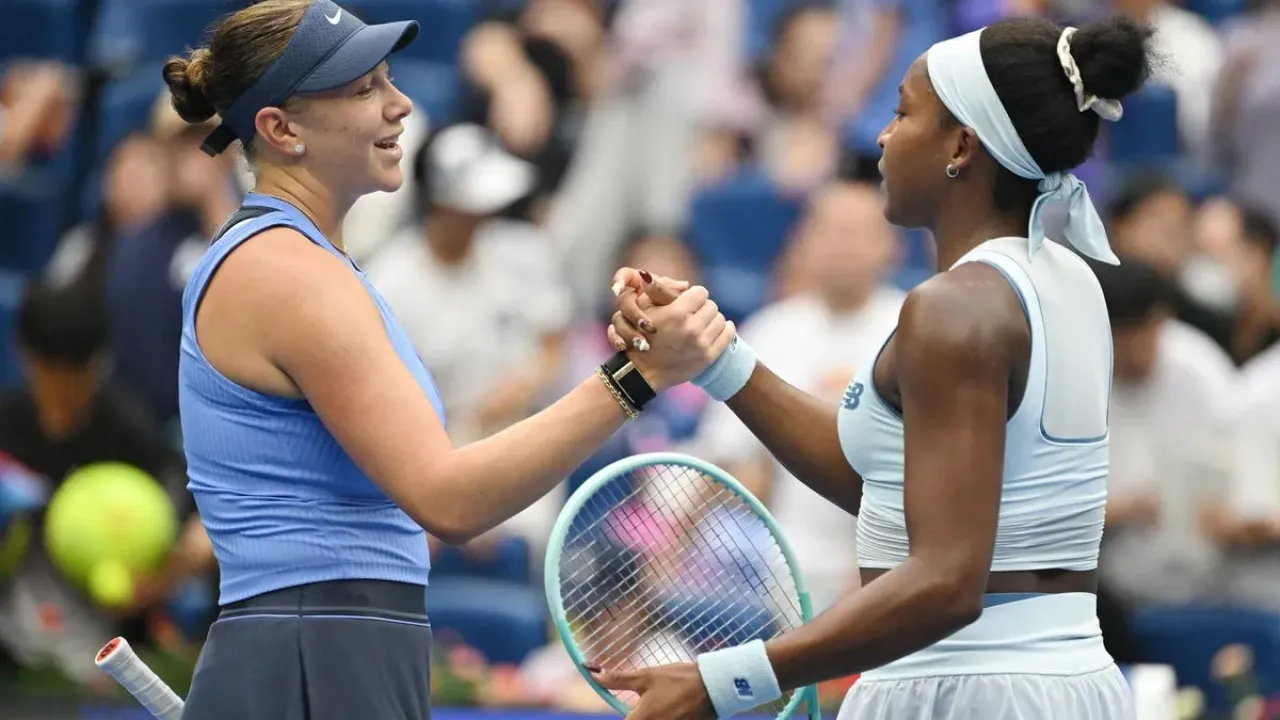Anisimova and Gauff shake hands after the 6-1 6-2 win  (AFP via Getty Images)