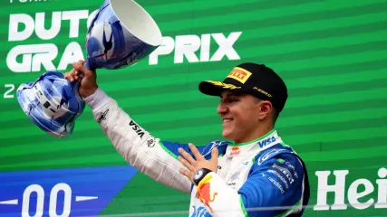 August 31, 2025 RB&#39;s Isack Hadjar celebrates on the podium with a trophy after finishing third place in the Dutch Grand Prix