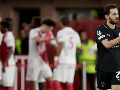 Bernardo Silva looks disappointed as Monaco players celebrate