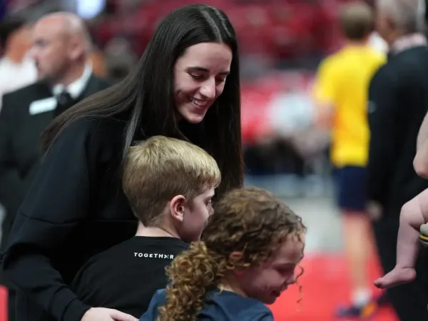Caitlin Clark with fans during the playoffs. NBAE via Getty Images
