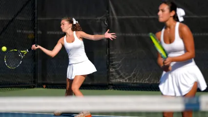 Cedar Rapids Xavier's Tia Halabi, left, and Gemma Younadam, right, won the Class 1A doubles state championship in Iowa City on Oct. 2.
