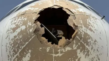 Damage to nose of Delta Air Lines aircraft from flying into hail in 2023, according to Italian accident report. - ANSV