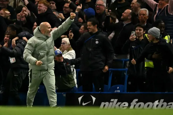 Enzo Maresca celebrates Chelsea’s win over Liverpool, after he was sent off (AFP via Getty Images)
