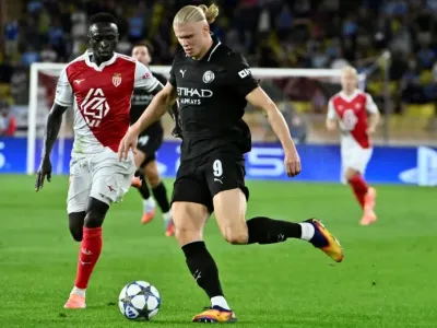 Erling Haaland scored twice but Manchester City had to settle for a 2-2 draw at Monaco in the Champions League on Wednesday (FREDERIC DIDES)