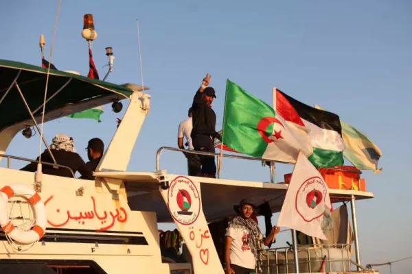 FILE PHOTO: Crew interacts from aboard a boat, part of the Global Sumud Flotilla aiming to reach Gaza and break Israel