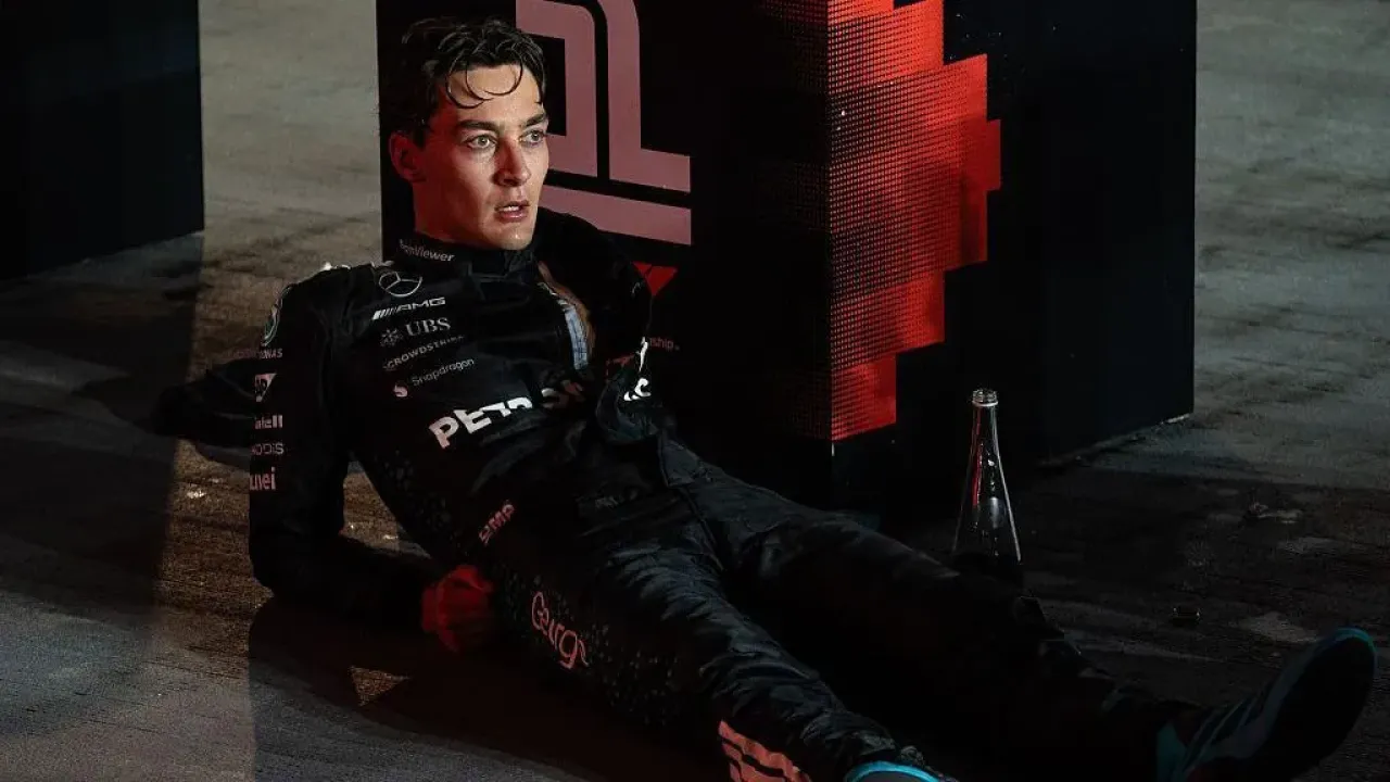 George Russell lying down and looking exhausted after the Singapore Grand Prix