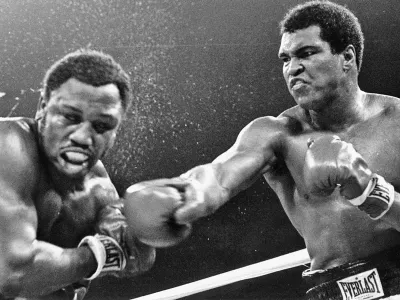 In their third clash, Muhammad Ali (right) secured a TKO to go 2-1 against Joe Frazier (AP)