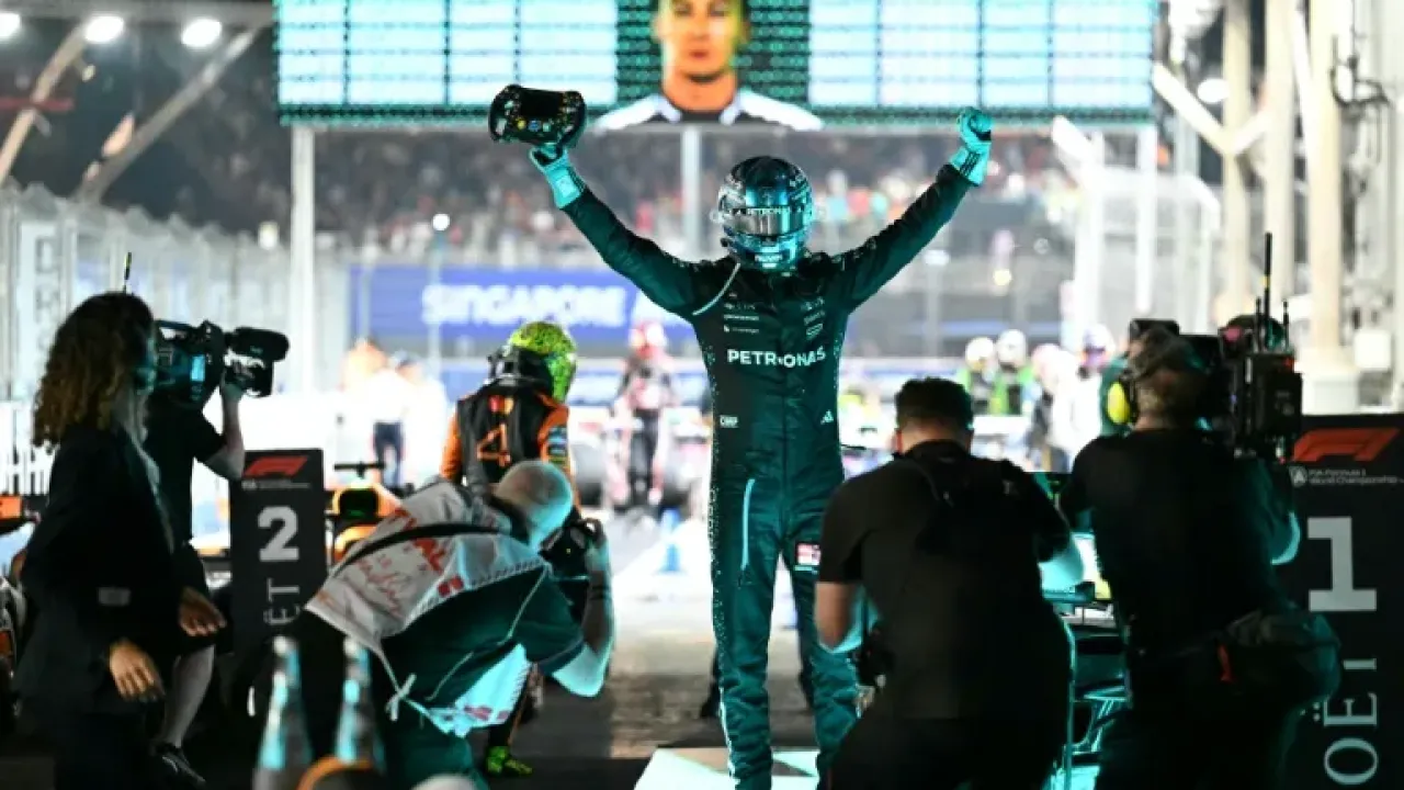 Mercedes driver George Russell celebrates his victory in the Singapore Grand Prix (MOHD RASFAN)