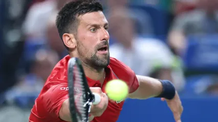 Novak Djokovic plays a forehand against Marin Cilic at the Shanghai Masters