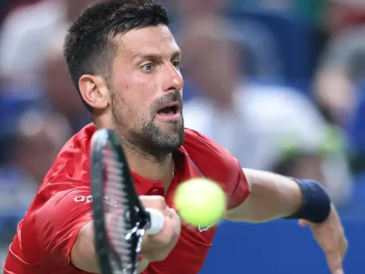 Novak Djokovic plays a forehand against Marin Cilic at the Shanghai Masters