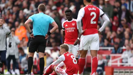Odegaard injury sours landmark Arsenal win as Saka hits new milestone