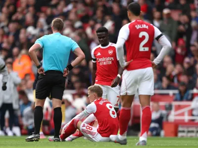 Odegaard injury sours landmark Arsenal win as Saka hits new milestone